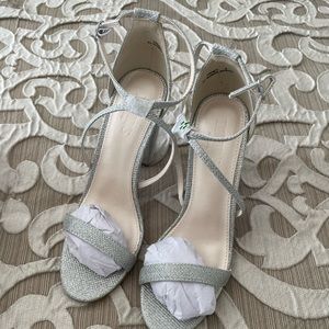 Brand new, size 8, silver heels